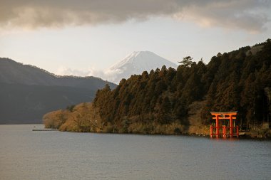 Snocapped Mount Fuji viewed from Hakone lake, Japanese shrine, Japan clipart
