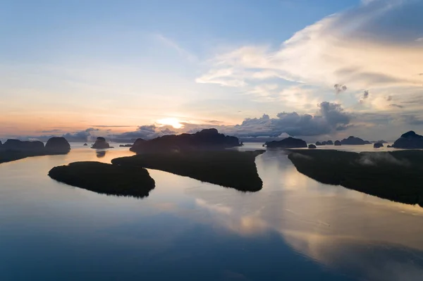 Amazing Landscape light nature scenery view, Beautiful light sunrise or sunset over Tropical sea and mountains peak in thailand Aerial view Drone camera shot High angle view.