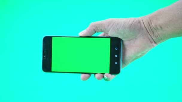 Close Man Hand Holding Smartphone Mobile Phone Green Screen Background — Stock video