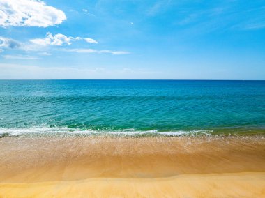 Aerial view of a blue sea surface water texture background and sun reflections Aerial flying drone view Waves water surface texture on sunny tropical ocean