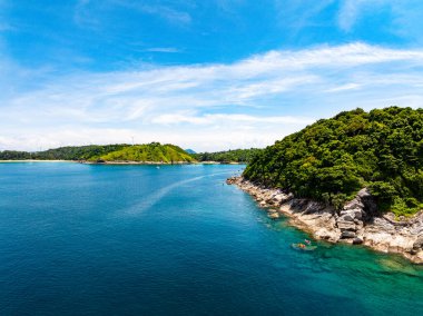 Aerial view of a blue sea surface water texture background and sun reflections Aerial flying drone view Waves water surface texture on sunny tropical ocean