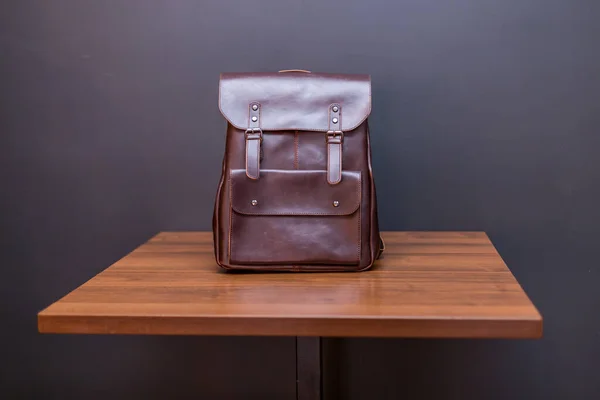 Brown Leather Backpacks Wood Table Unisex Bag — Stock Photo, Image