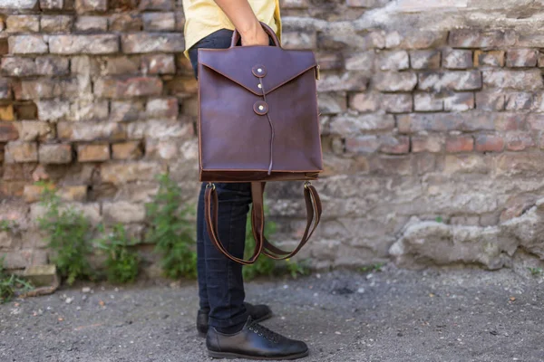 Man Holding Brown Leather Backpacks Hand Unisex Bag — Stock Photo, Image