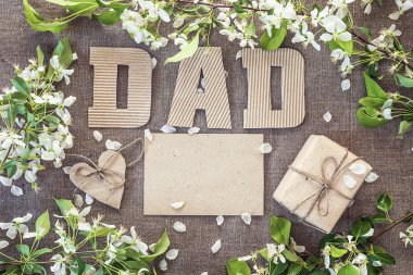 Fathers Day message from cardboard letters, blank card and a gif clipart