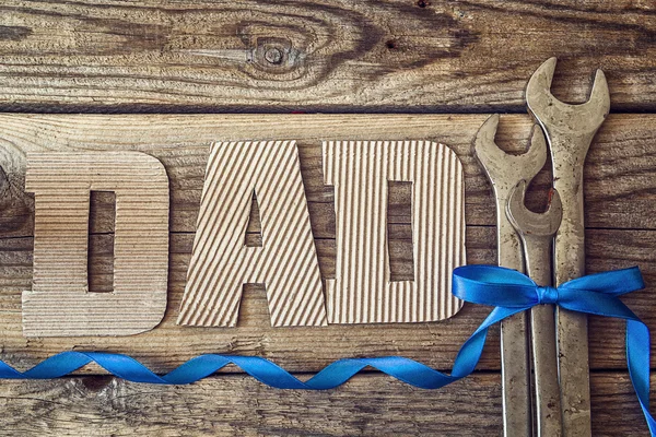 Fathers day background with cardboard letters and spanners. — Stock Photo, Image
