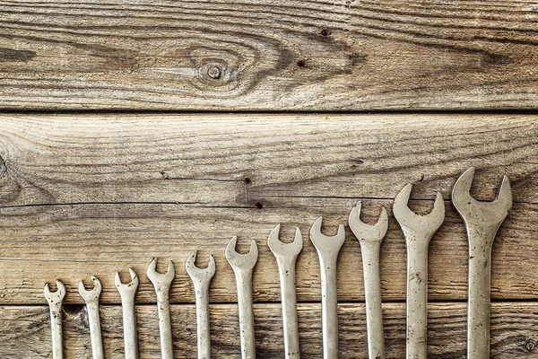 Set of wrench on old wood background. — Stock Photo, Image