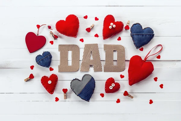 Fathers day background with cardboard letters and variety of han