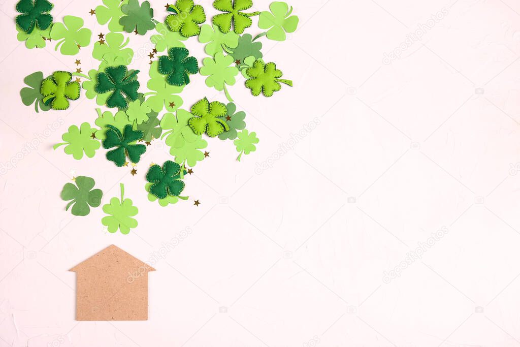 Lucky home symbol with four-leaf clover on white  background. Copy space for text. St.Patrick's day concept. 