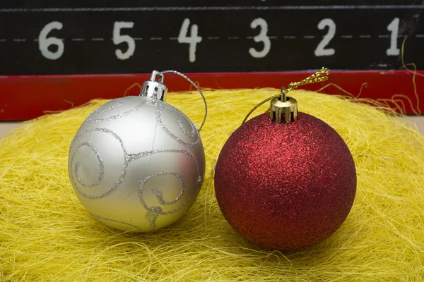 Two Chirstmas 's ball close up on yellow thread — Stock Photo, Image