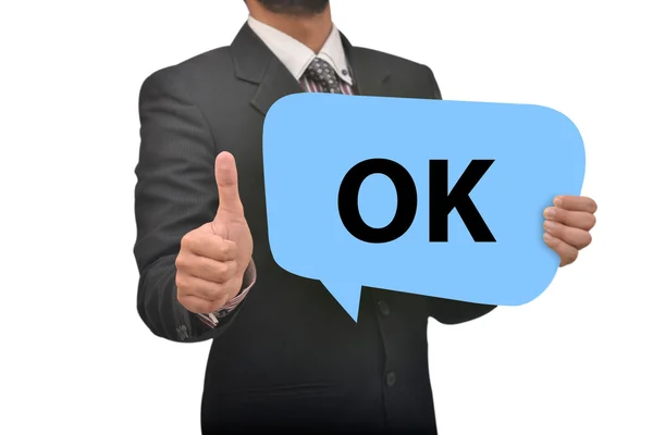 Professional holding Ok Speech Bubble in Hand with thumbs up impression — Stock Photo, Image