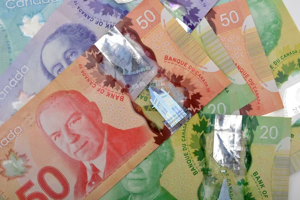 Canadese dollar munt bank merkt op achtergrond — Stockfoto