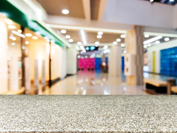 Marble empty table in front of blurred mall