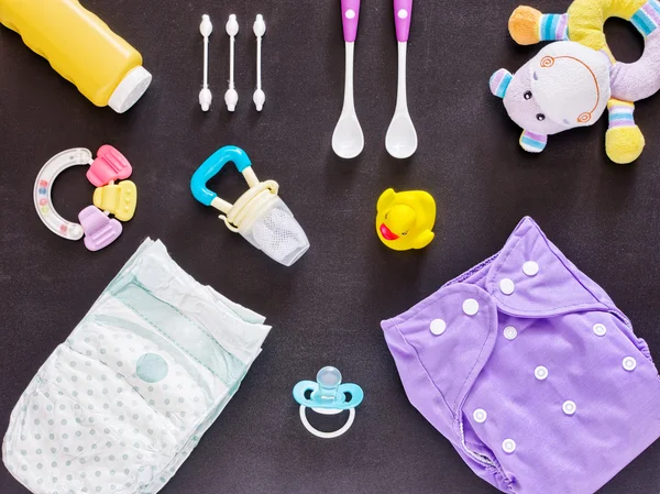 Flat lay of baby set with cloth diaper