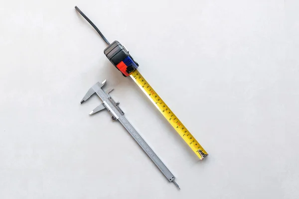 Vernier and measuring tape. — Stock Photo, Image