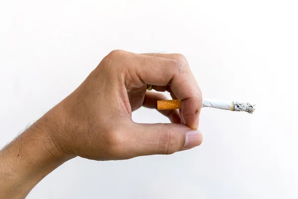 Cigarette in hand isolated on white background. — Stock Photo, Image