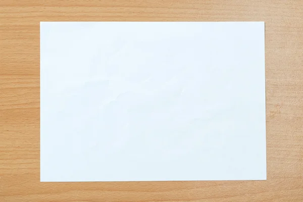 White paper  on a wooden floor. — Stock Photo, Image