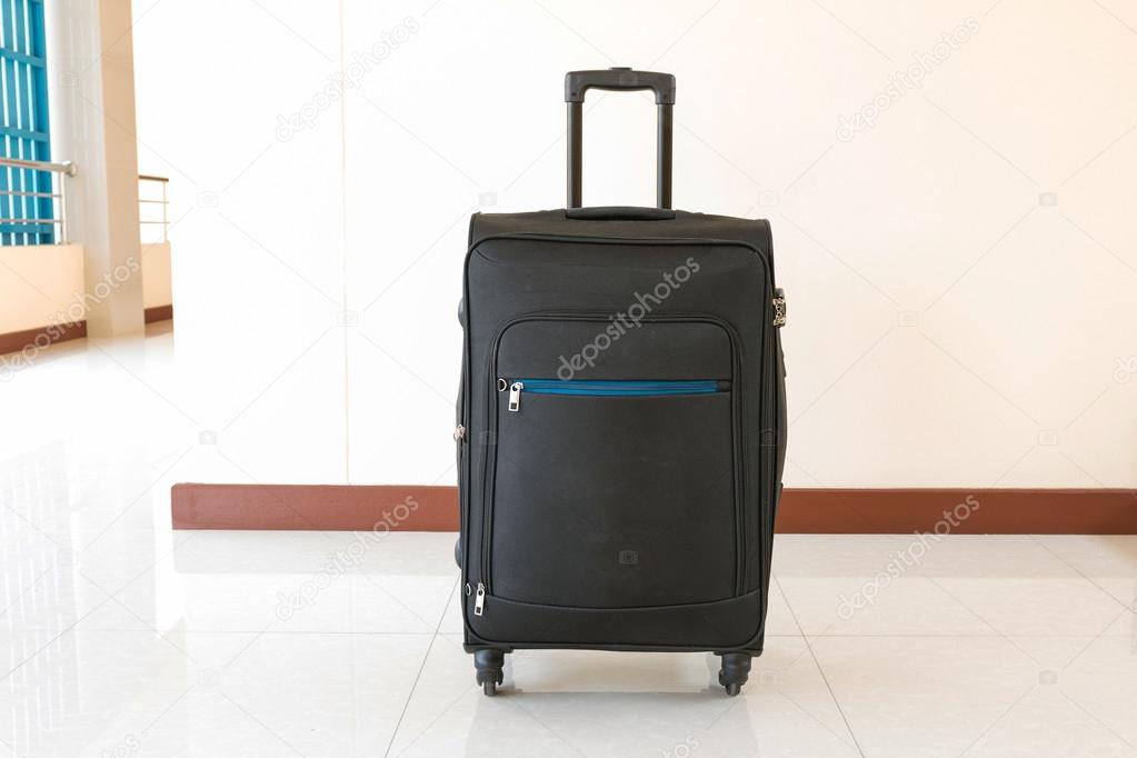 Black suitcase or luggage on white background.