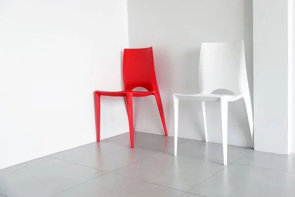 Red and white plastic chairs. — Stock Photo, Image