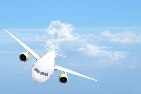 Front view of the passenger aircraft in the sky. Stock Image
