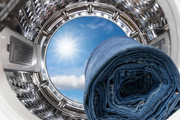 Blue jeans inside the washing machine. — Stock Photo, Image