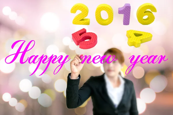 Young business woman write words Happy New Year. — Stock Photo, Image