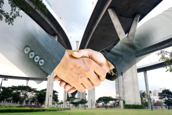 Double exposure of business handshake. — Stock Photo, Image