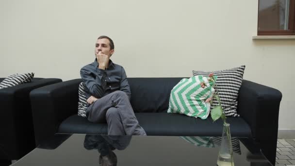 Man with Smartphone and Sitting on Couch — Stock Video