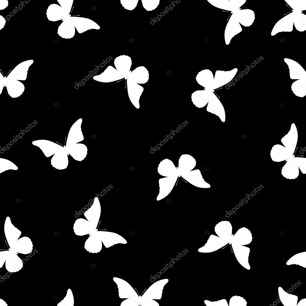 White butterflies on black background.