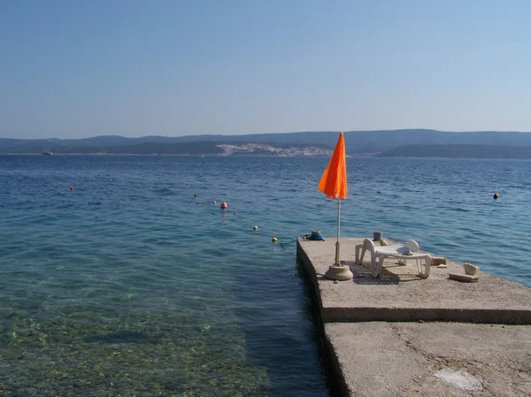 Pier na praia croata — Fotografia de Stock