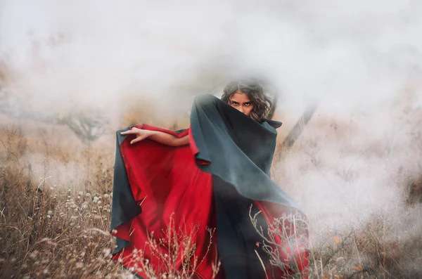 Vampire girl  Dracula in a raincoat — Stock Photo, Image