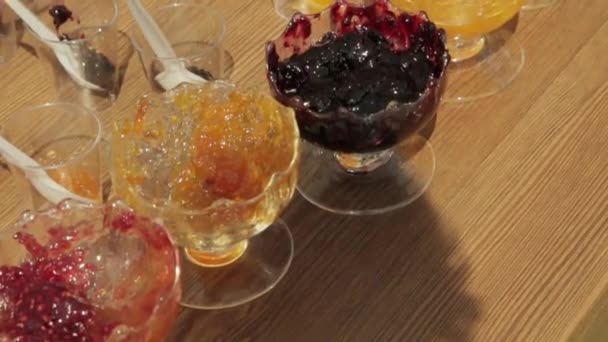 Various jars of fruit jam — Stock Video