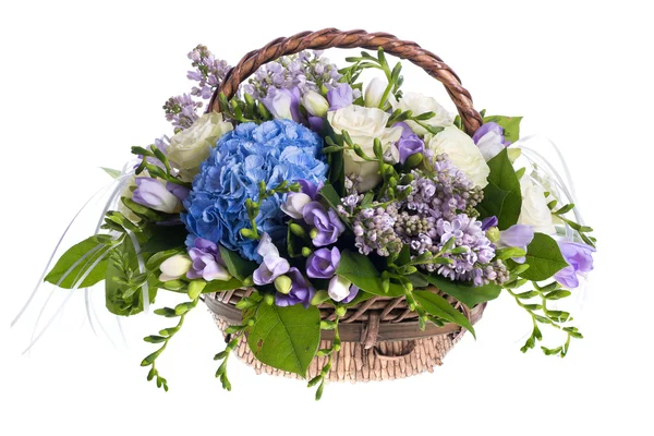 Bouquet of flowers in a basket — Stock Photo, Image