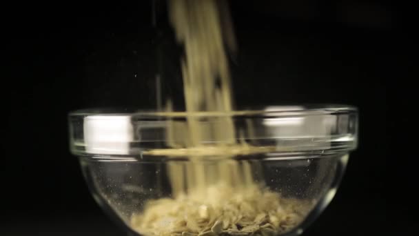Pouring Milk Onto Muesli Into Bowl — Stock Video