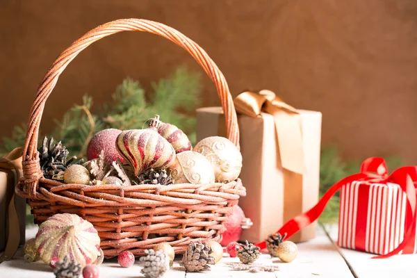 Christmas basket with red and golden ornaments — Stock Photo, Image