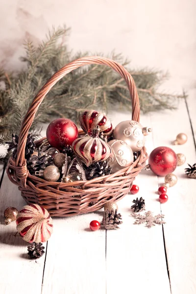 Christmas basket with red and golden ornaments