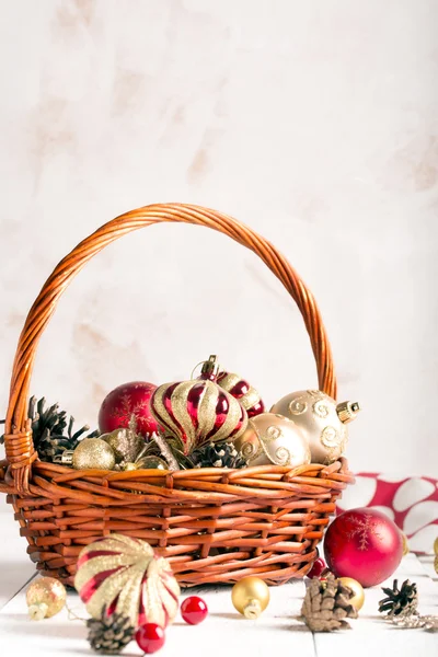 Christmas basket with red and golden ornaments — Stock Photo, Image