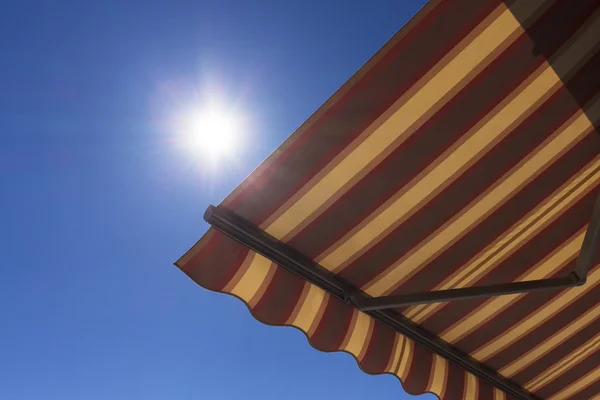 Sun shade  with blue sky in the background