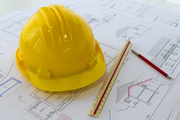 An office desk with the project papers and protective helmet — Stock Photo, Image