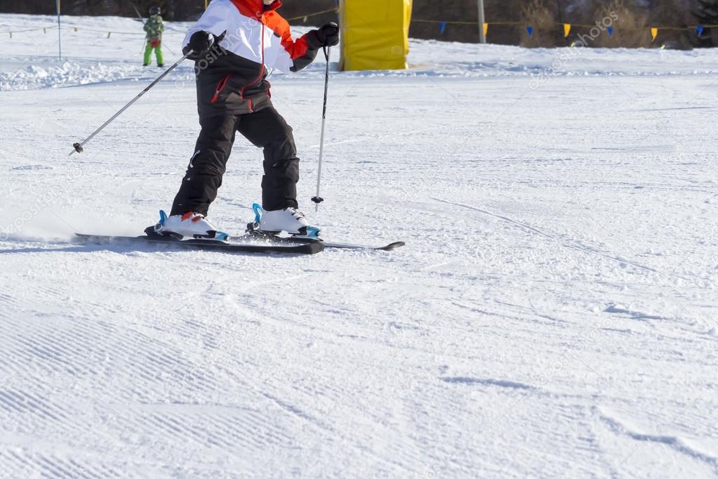 Child beginner ski slope on the snow