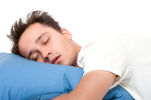 Disheveled man sleeps at blue pillow