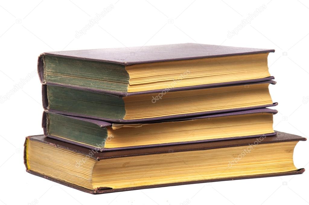 Stack of old books isolated on white.
