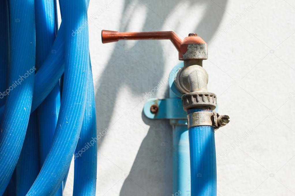 Garden faucet and blue hose pipe