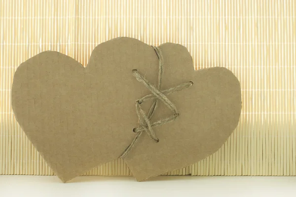 Two connected hearts made of cardboard — Stock Photo, Image