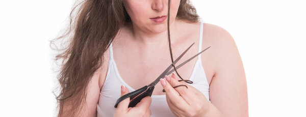 woman with scissors on white background