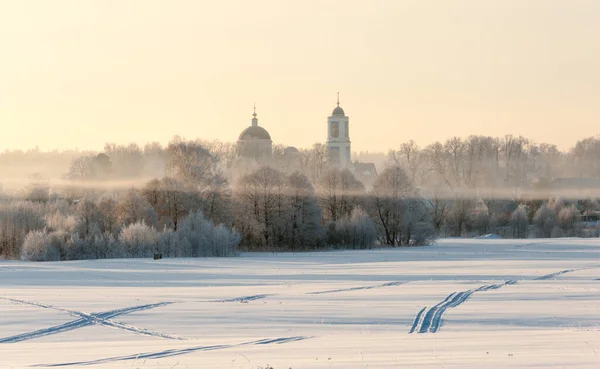 Foggy Spring Morning Snowy Field Church Visible Distance Stock Picture