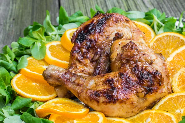 Grilled Chicken with Oranges and Salad on a Silver Tray