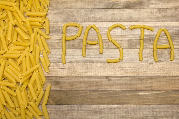Texto de pasta hecha de pasta cruda — Foto de Stock