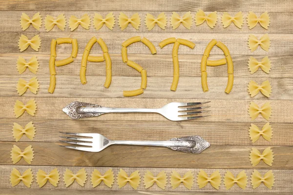 Texto de pasta hecha de pasta cruda — Foto de Stock