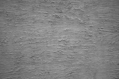 Gri renkli bir duvarda yapılmış desenli alçı.