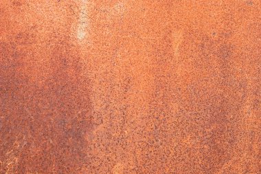 Eskimiş turuncu kahverengi pas ve soluk renkli çelik tabakta çizikler, duygusal arka plan veya duvar kağıdı için zaman ve tutku aşınması. Kahverengi ton endüstriyel görüntü arkaplanı.